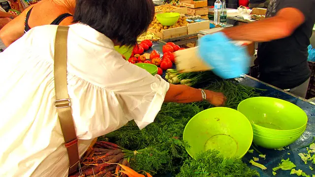 "Mrs. Easy Hiker shopping for salad nicoise in a market in Cannes"