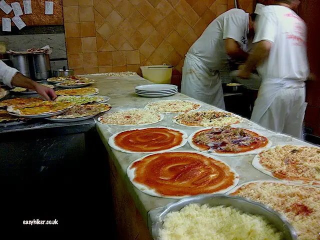 "Pizzeria ai Marmi preparing dozens of pizze - eating in Rome"