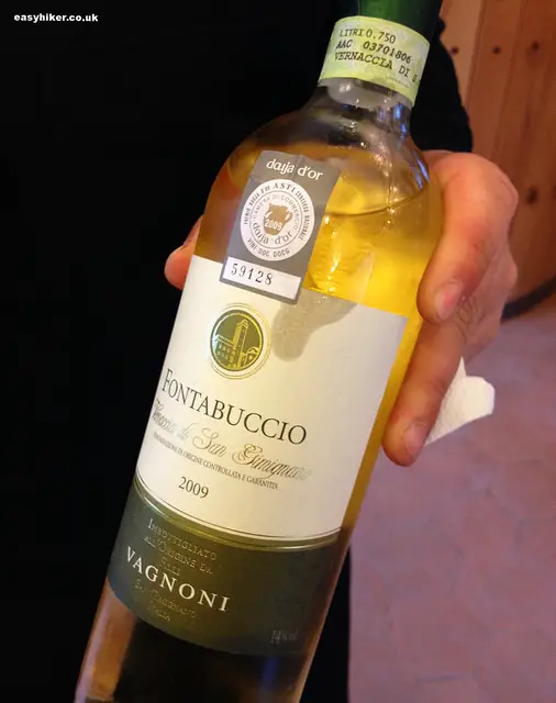 "Bottle of white wine Vernaccia - eating in Tuscany"