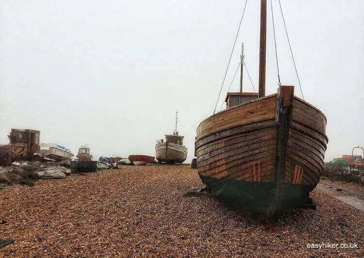 "the fishermen of Hastings and their docked boats"