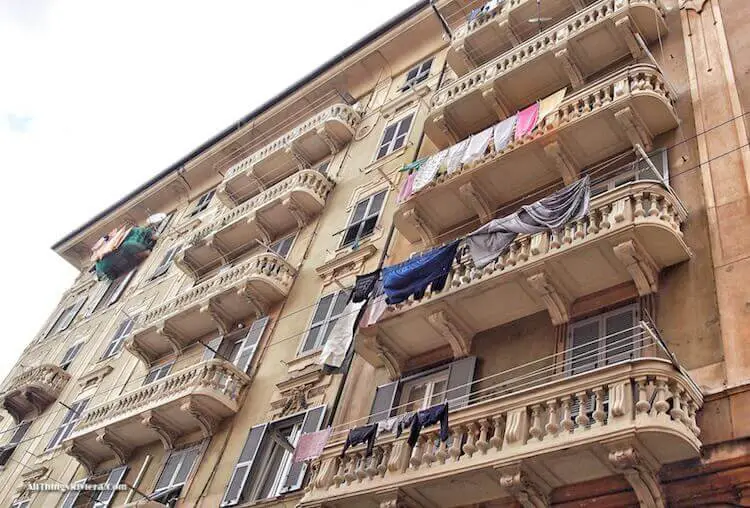 "Laundry hanging on balconies of post buildings in Sampierdarena"