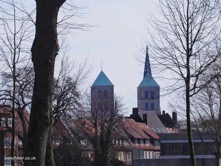 "Spires of the Cathedral and the Lamberti Church on a wall walk"