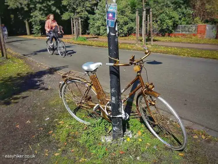 "gold bicycle along Muenster wall walk"