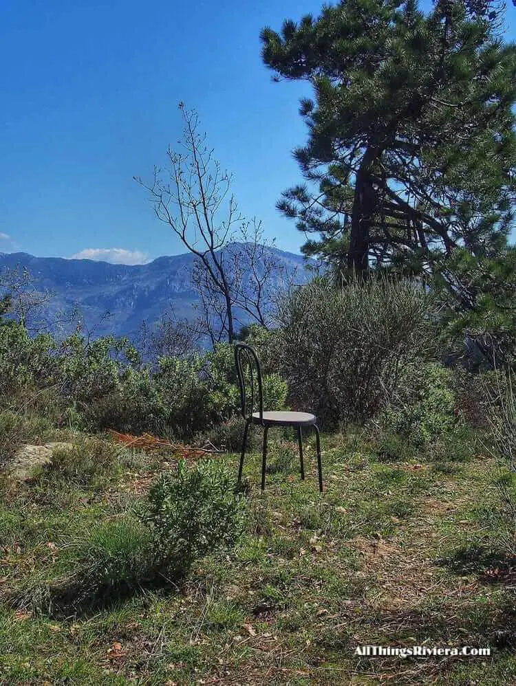 "abandoned chair on a trail hiking the French Riviera mountains"