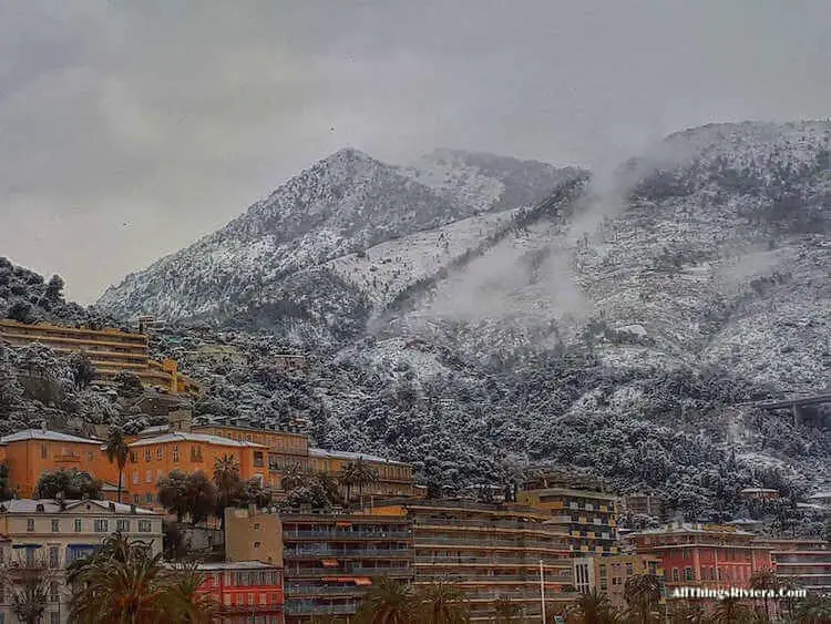 "the steep hills of Menton under snow"