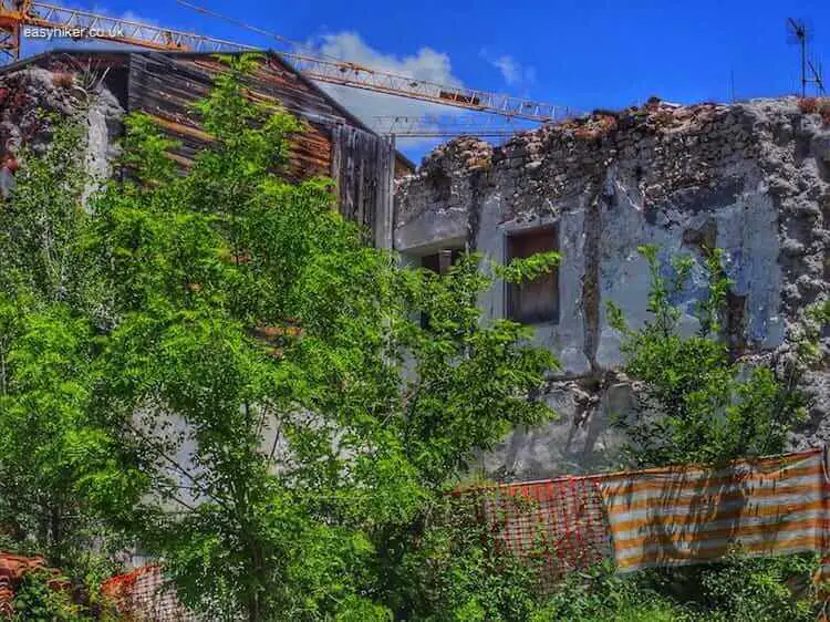 "working on ruins in L'Aquila - Eagle with Broken Wings"