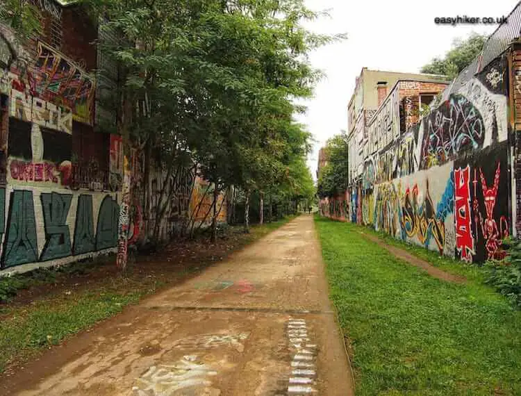 "street in Germany with graffitied walls"