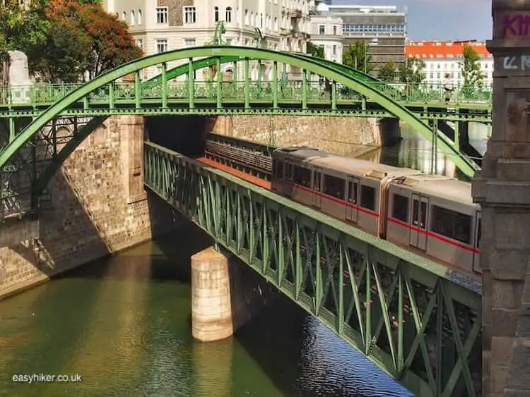 "metro train across bridge on short Vienna walk"