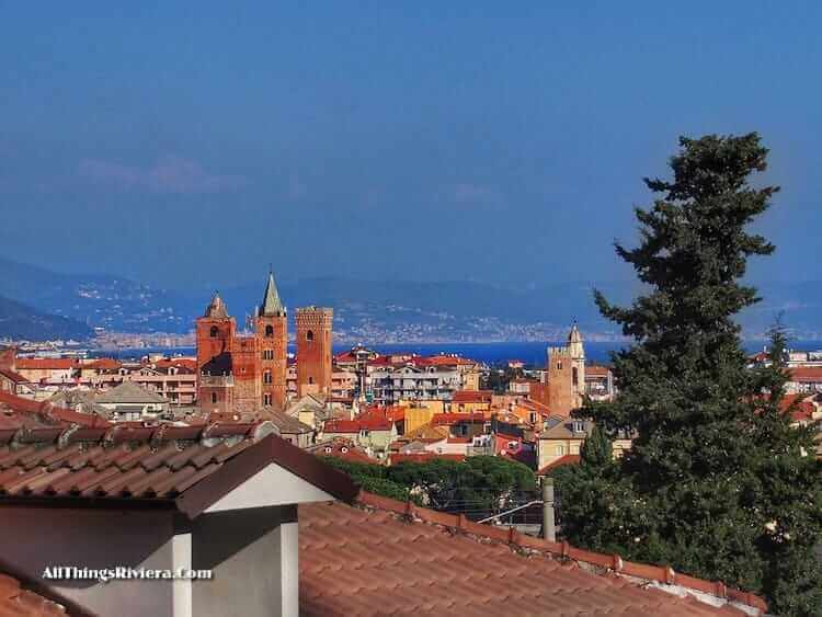 "the spires of Albenga seen from the trail"