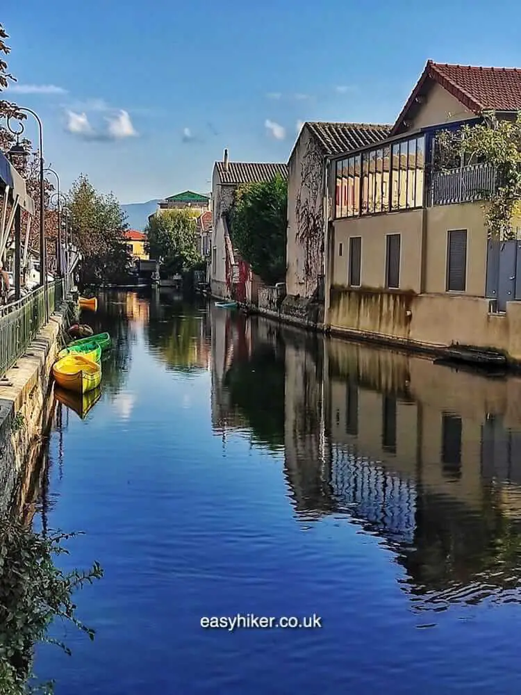 Moats and Motives of L’Isle-sur-la-Sorgue